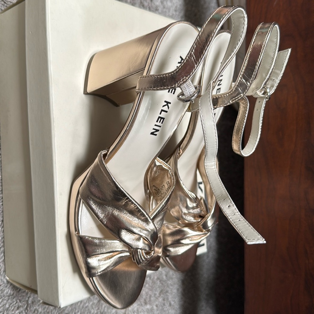 Brand new and Klein, black heel gold metallic sandals. In original box.
